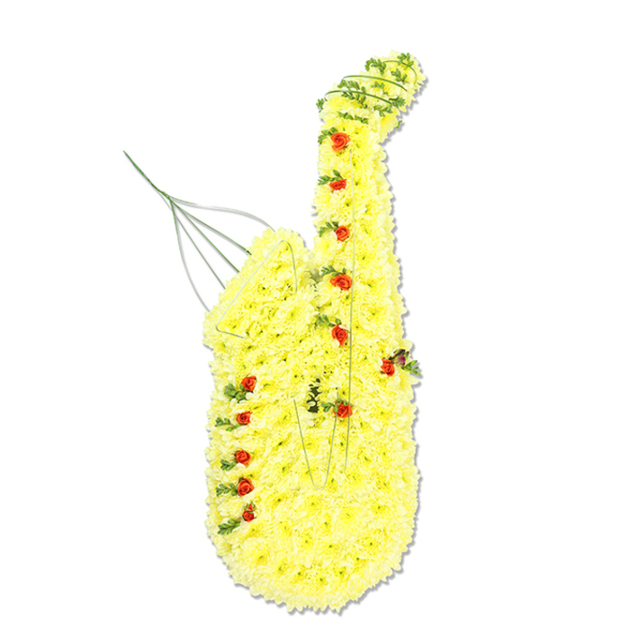 This image shows a large, saxophone-shaped floral tribute standing prominently against a bright white background, as if on a gallery plinth. The instrument's familiar silhouette is echoed in flowers: from the narrow mouthpiece and gracefully arched neck to the full, flared bell, every section is defined by a dense blanket of small, bright yellow chrysanthemum blooms. Each chrysanthemum head is tightly packed, creating a plush, almost velour-like surface that glows with a golden tone often associated with joy, friendship, and treasured memories. Nestled into this sunny base are numerous miniature red spray roses, placed thoughtfully along the line where the keys and mechanisms would sit, so that the instrument's functional details are suggested through dots of crimson. Interlaced among the yellow petals, particularly around the curves, are fine strands of deep green foliage, possibly ivy or similar trailing greenery, adding contrast, natural movement, and a sense of realism. Here and there, slender silver or green wires provide gentle structure, especially at the mouthpiece area, where a delicate upward flourish suggests both the stem of a flower and a musical note rising into the air. The stark, uncluttered background directs the eye solely to the tribute, highlighting the craftsmanship and careful symmetry of the design. Created with the sort of sensitivity and skill you might find at Flowers Oxford, often asked to design music-themed tributes for funerals near Headington, Summertown, or around Oxford's historic college chapels, this arrangement feels like a loving salute to a life lived in harmony with music, blending sorrow, respect, and an enduring sense of celebration.