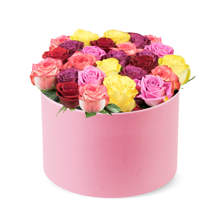 Luxuriant and meticulously arranged, this stunning floral display sits in a soft pink round hat box, a perfect harmony of texture and pastel tone. The velvet-like exterior of the container absorbs the light, giving the box a quiet opulence that invites a closer look. Against a pristine white backdrop, dozens of tightly formed roses spill from the rim, creating a dense dome that speaks of expert design. The bouquet carries a refined sense of ceremony, as if prepared in a boutique studio on Oxford's High Street, ready to mark a moment with style.
The colour story is majestic: crimson red anchors the arrangement with regal depth, complemented by magenta, rich burgundy, and a spectrum of pinks from soft blush to vibrant fuchsia, with hints of cream. Bi-colour petals weave through the bouquet, adding warmth and movement. Leaves remain a delicate fringe beneath the blooms, allowing the petals to dominate and the perfume to linger in the air. Each bloom looks fresh, with smooth petals that hold their form, evidence of careful handling and premium sourcing.
As a gift, it embodies celebration, romance, and thoughtful luxury. It's ideal for Valentine's Day, anniversaries, or a heartfelt surprise delivered by a trusted Oxford florist across the city-from the university campuses to Summertown and Headington. This elegant rose box promises more than beauty: it offers a tangible moment of elegance, a signature of craftsmanship that harmonises with home décor and special occasions, and an invitation to pause and savour the scent of a well-tended garden.
