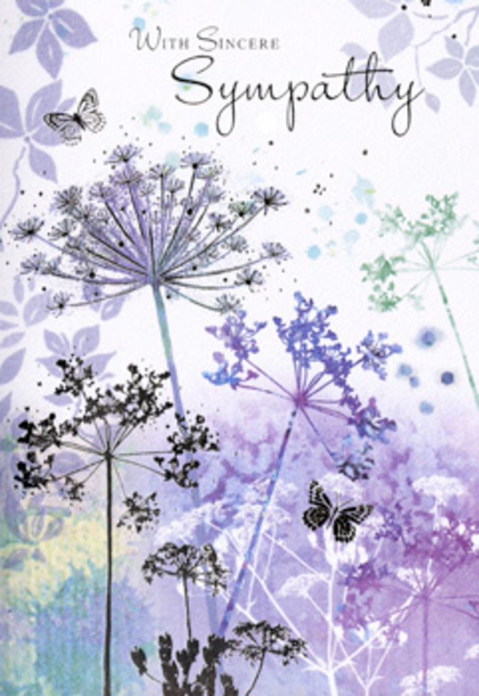 The design of this funeral sympathy card feels like standing in a quiet corner of an Oxford college garden at dawn, when the world is softened by early light. Slender wildflower stems rise from the base of the card, each carrying intricate umbel-shaped heads, their fine filigree outlines drawn in soft violets, powdered blues, and shaded greys. The background is a gentle wash of colour-violet melting into lavender, with silvery greens and pale blue-grey fading toward the edges-creating the impression of distant fields or a misty horizon beyond the flowers. Nothing is sharply defined; instead, everything is delicately blended, like reflections on the water by Folly Bridge after rain. Two butterflies hover above the airy petals, their wings barely brushed in, a whisper of pattern and light that adds a quiet note of hope. The atmosphere is one of contemplation, the sort of stillness you feel when pausing in Worcester College gardens, aware of both sorrow and the enduring comfort of nature. As an Oxford florist accustomed to arranging funeral tributes for services in local churches and crematoria, I see in this card a visual expression of gentle understanding. The composition is balanced without being rigid, and the colours are calm without feeling cold. It invites the eye to travel slowly across each stem and petal, mirroring the act of remembering someone dearly missed. This is a card that would sit gracefully beside a simple sheaf or wreath, its artwork offering a quiet space to breathe, reflect, and feel supported.