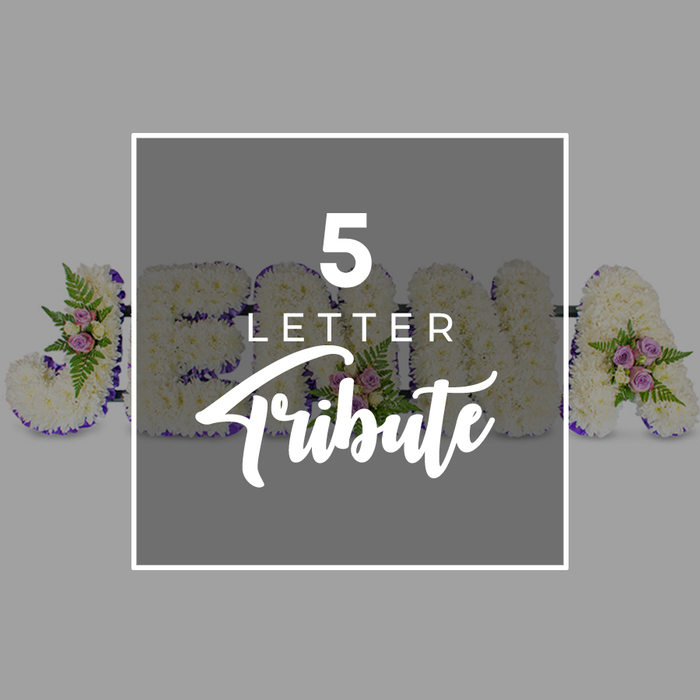 This image shows a refined five-letter floral name tribute, photographed from above against a smooth, light grey backdrop that keeps the focus entirely on the flowers. The letters are large and substantial, each one densely covered in fresh white chrysanthemum blooms so closely packed that no gaps in the base are visible. Their ruffled petals give a soft, almost downy surface, suggesting tenderness and care. Around the outer contour of every letter runs a band of deep purple satin ribbon, its rich tone and slight shimmer providing a crisp outline and a sense of formality appropriate to a funeral or memorial. Intermittent clusters of small pale pink and mauve roses rest on top of the white base, arranged with sprigs of airy green fern and complementary foliage, so that gentle touches of colour and texture appear in balance along the tribute. Although a central overlay partly conceals the design, you can still make out what seems to be a personal name: a J on the far left, then an O, H, and N overlapping beneath the middle panel, with an A at the far right. This helps demonstrate how the tribute can be tailored to any five-letter name or word, such as those often chosen by families from areas like Jericho, Iffley, or North Oxford to honour a loved one. At the centre of the composition sits a grey square with a white border, its slightly darker tone ensuring the white type stands out. The text 5 LETTER appears in a clean, uppercase sans-serif font above the word Tribute scripted in a more flowing style. Overall, the arrangement communicates peace, remembrance, and personalised respect, as you might expect from a florist experienced in creating thoughtful funeral flowers for services throughout Oxford.