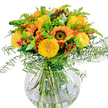 Glowing with the essence of summer days along the Oxford canals, this bouquet is an ode to happiness and sunlight. Gathered expertly in a clear, round vase, the arrangement unites radiant yellow sunflowers, golden garden roses, and plush greenery-each blossom and leaf thoughtfully placed to create a sense of movement and harmony. The sunflowers, bold and open, share space with roses whose petals spiral delicately, their rich hues reflecting the cheerful streetscapes of Cowley and Headington. Accents of tiny red Hypericum berries punctuate the composition, adding playful pops of color that enliven the entire display. Wisps of fern and sprays of goldenrod introduce airy lightness, allowing the eye to dance from one bloom to the next, while subtle eucalyptus leaves in cool blue-green tones provide a gentle calm. Beneath, the crystal-clear vase offers a glimpse of vibrant stems interlaced in fresh water, lending an authentic, natural feel reminiscent of Oxford's botanic gardens. The arrangement exudes an uplifting scent and carries with it a sense of open fields and carefree afternoons. Whether chosen for a joyous event, as a centerpiece for a High Street gathering, or as a gesture to brighten someone's day, this bouquet reflects the artistry of Flowers Oxford, bringing local beauty and a touch of warmth into every home.