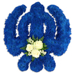 A bold and reverent floral interpretation of the Sikh Khanda symbol is displayed on a crisp white background, its unmistakable outline crafted entirely from lush royal blue blooms. The rounded chakkar, straight central sword, and sweeping twin kirpans are all defined by tightly packed chrysanthemum-style flowers, giving the tribute a soft yet structured texture, like a ceremonial emblem made from petals. The blue colour is uniform and saturated, creating a sense of calm strength, while gentle shading around the edges adds depth, suggesting the tribute stands slightly proud from its base. At the lower centre of the design, just where the eye finds rest, a contrasting cluster of white and green flowers introduces a note of serenity. Three perfectly formed white roses, their petals layered and luminous, sit at the heart of this accent, cradled by fine sprays of tiny white flowers that resemble baby's breath. A ring of fresh, deep green foliage frames this central posy, lifting the whites and making them appear even more radiant against the blue. The arrangement feels meticulously planned and lovingly executed, the kind of bespoke sympathy tribute often chosen by Sikh families in Oxford to honour a loved one's life and beliefs, perhaps for a service near Wolvercote or Littlemore. The combination of the sacred Khanda shape, the contemplative royal blue, and the pure white roses speaks quietly of devotion, courage, remembrance, and hope, offering a respectful floral farewell that reflects both personal loss and enduring spiritual connection.