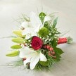 The essence of Oxford's botanical beauty is perfectly captured in this hand-tied bouquet, elegantly set against a soft, off-white surface. Immaculate white lilies command attention at the upper left, several unfurling into full, open majesty and others poised in fresh, lime-green bud, suggesting the promise of tomorrow-much like new beginnings along Oxford's historic avenues. At the arrangement's heart lies a single, opulent red rose, petals velvety and deep, its tone reminiscent of the city's storied romance and scholarly heritage. Unique mossy clusters of green Dianthus or button chrysanthemums add a contemporary texture and depth, contrasting beautifully with the lilies' classic form. Wisps of delicate baby's breath (Gypsophila) float airily throughout, their petite white blossoms creating an ethereal layer, while the bouquet's overall structure is enhanced by bold, glossy greenery, possibly Ruscus or Salal, and lighter, feathery accents that suggest movement and fullness. Sparkling red hypericum berries peep through the foliage, adding playful splashes of colour and a natural woodland charm one might find in the wild corners of Headington Hill Park. Bound together with a gleaming red satin ribbon, the bouquet is both sophisticated and festive, blending tradition with a hint of modern artistry. Presented by Oxford's expert florists, this arrangement is ideal for weddings, anniversaries, or heartfelt gifts, expressing themes of love, celebration, and authentic local beauty.