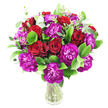 A vibrant, rounded bouquet sits in a clear glass vase, its lush silhouette defined by deep crimson roses and ruffled magenta-purple carnations that seem to lean into one another. Some roses remain tightly furled, their velvety spirals promising intimacy, while others unfurl just enough to reveal layered, satiny petals catching a soft, diffuse light; beside them, the carnations open in dense, frilly heads, their almost-fuchsia tones introducing a joyful, textural contrast. Bright, glossy green foliage - the broad, resilient leaves of ruscus or a similar greenery - fills the spaces between blooms, creating a verdant matrix that makes the reds and purples sing. Sprays of silvery-green eucalyptus thread through the composition, adding pale, rounded leaves that lift the gaze and introduce a faint, cooling scent that balances the warm, floral perfume. The arrangement is tightly clustered and full, the stems visible through the transparent vase which lends an honest, fresh aesthetic and a sense of everyday elegance. Against a pristine white background the colours pop with clear definition: deep red, vivid magenta-purple, and layered greens forming a visually rich, celebratory tableau. The bouquet radiates a feeling of heartfelt occasion - ideal for an anniversary or a birthday - and carries the careful hand of a florist who understands proportion, texture, and scent. Imagine this arrangement brightening a dining table in Jericho or welcoming guests on a hallway console near Oxford's Covered Market, where a local touch and a sense of thoughtful craft matter as much as the flowers themselves.