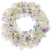 This image presents a beautifully crafted sympathy wreath, perfectly circular and positioned against a simple white backdrop that enhances its delicate details. The wreath is lavishly packed with Baby's Breath, each minute white blossom forming part of a soft, cloud-like garland that encircles the entire design. Among these countless Gypsophila clusters stand refined Lisianthus flowers, gently emerging like small, ruffled stars in the sky over Oxford on a still evening. Their silky petals open in clear white, then deepen at the edges into tranquil lavender and violet, creating a painted effect that feels calm and contemplative. A mix of fully open blooms and half-closed buds adds subtle variation, the buds tinged with fresh green and cream tones that suggest tenderness and the continuation of life. The middle of the wreath remains open and unadorned, a quiet circular space that draws the eye inward and symbolises an unending bond of love and memory. With no bold foliage or additional colours, the palette remains serenely restrained, focused on the harmony of white and soft purple. The arrangement feels particularly suited to a funeral, cremation, or memorial gathering in Oxford, where families might wish to send a wreath that offers gentle comfort. It conveys respect, serenity, and heartfelt sympathy, as though the flowers had been arranged with deep care and understanding for the emotions carried into such a farewell.